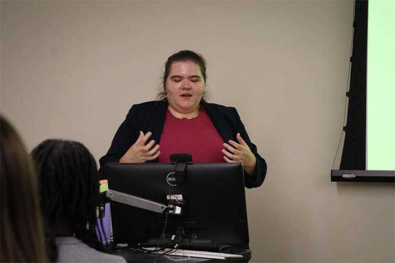 Ellen Hine speaks to a class.